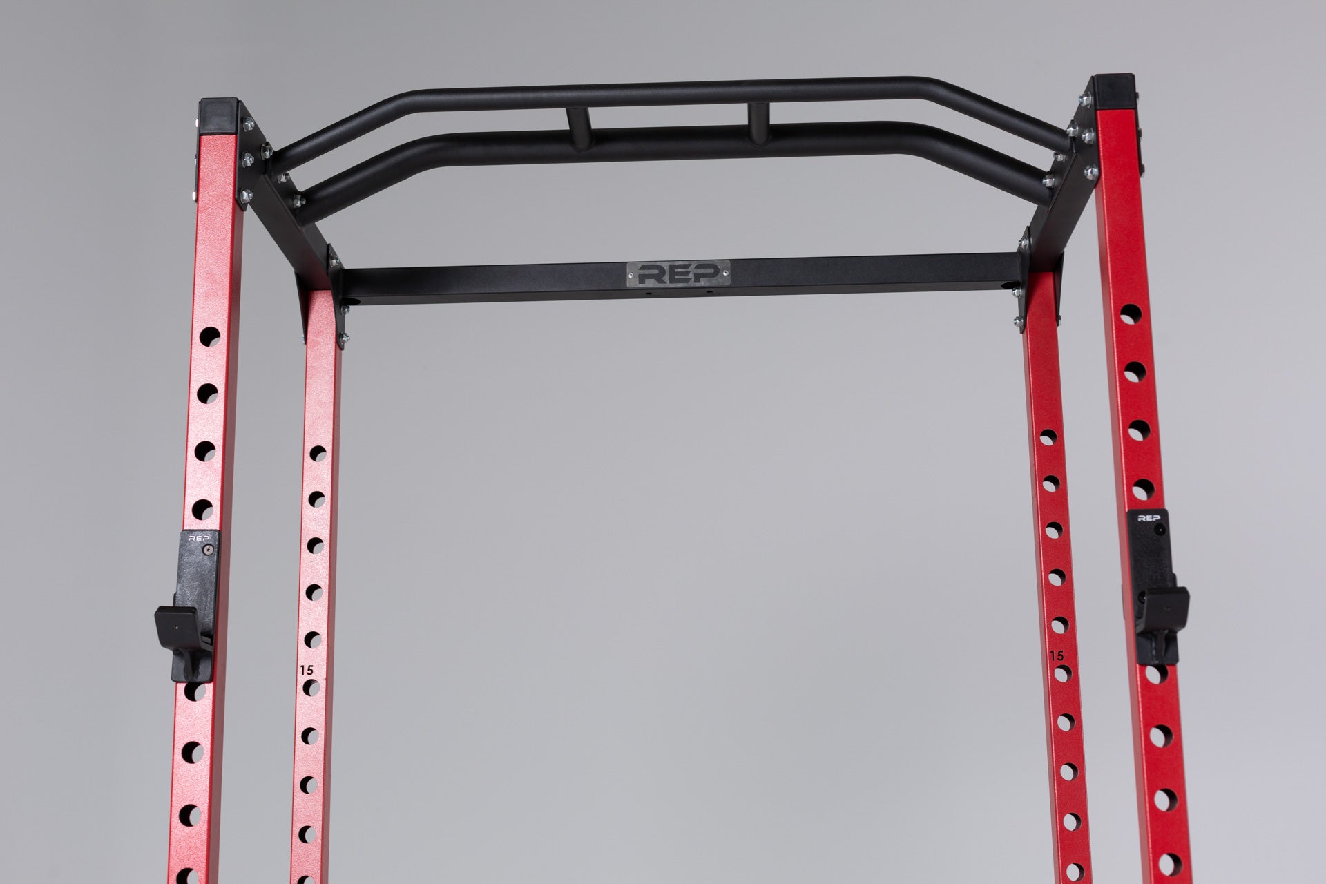 PR-1100 Power Rack Red Close Up With Standard J-Cups on Uprights and the Multi-Grip Pull-Up Bar
