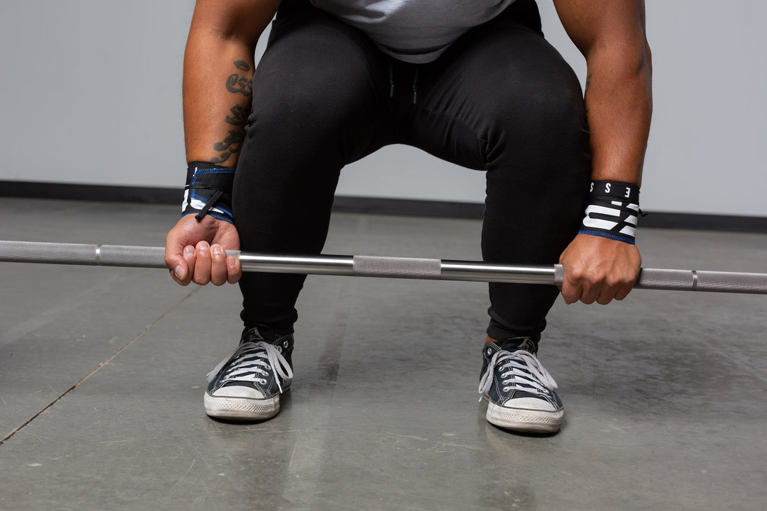 Powerlifter deadlifting on a power bar